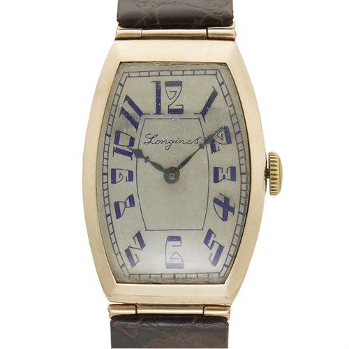 Lot 35 - A fourteen karat gold tonneau case strap watch, Longines