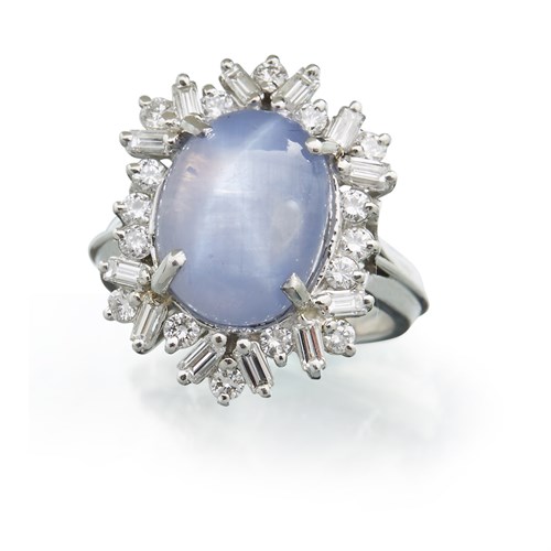 Lot 19 - A star sapphire, diamond and platinum ring