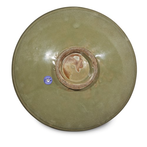 Lot 35 - A Chinese Yaozhou celadon-glazed stoneware dish