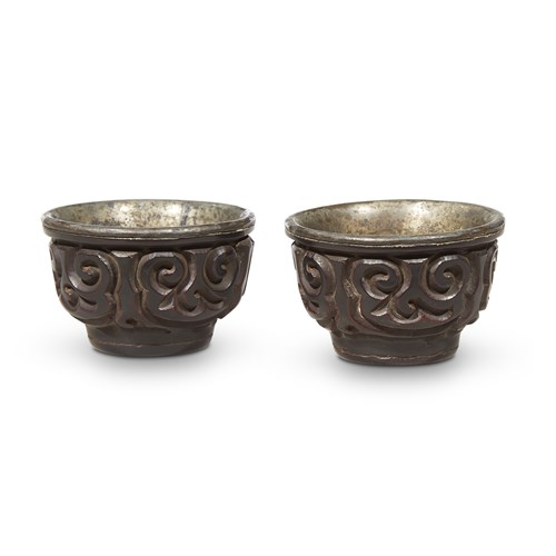 Lot 87 - A pair of Chinese silver-lined "tixi" lacquer cups