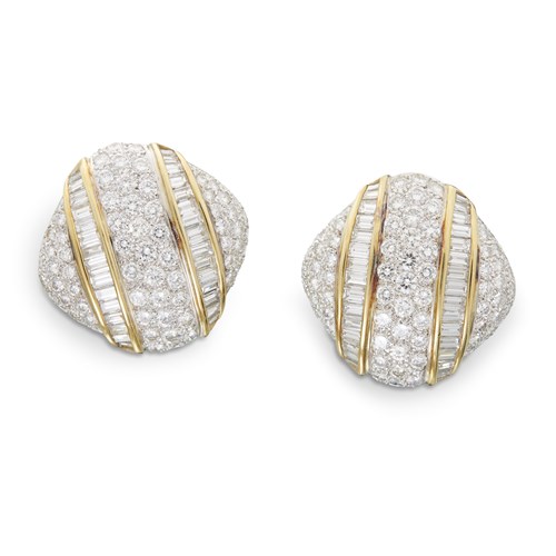 Lot 84 - A pair of diamond and eighteen karat two tone earrings