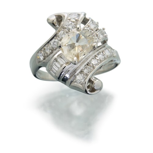 Lot 7 - A diamond and fourteen karat white gold ring