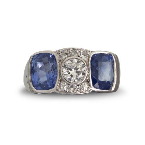 Lot 66 - A sapphire, diamond and fourteen karat white gold ring