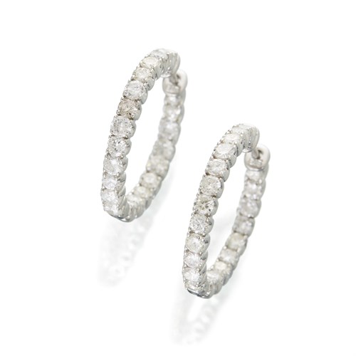 Lot 16 - A pair of diamond and fourteen karat white gold hoop earrings