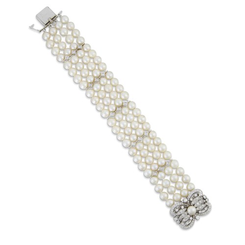 Lot 45 - A cultured pearl, diamond, and fourteen karat white gold bracelet